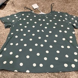 Green polka dots T-shirt.
